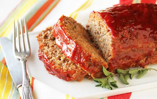 A close up of a loaf of meat on a plate