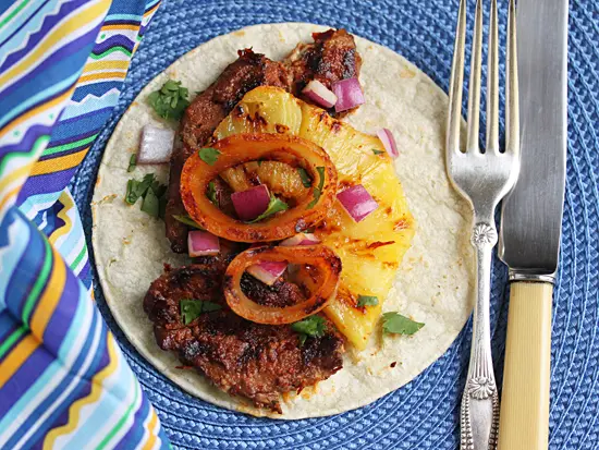 A plate with some food on it and a fork