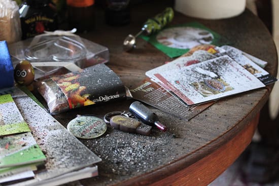 A table with some old magazines and papers on it