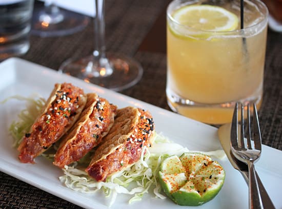 A plate of food and drinks on the table.