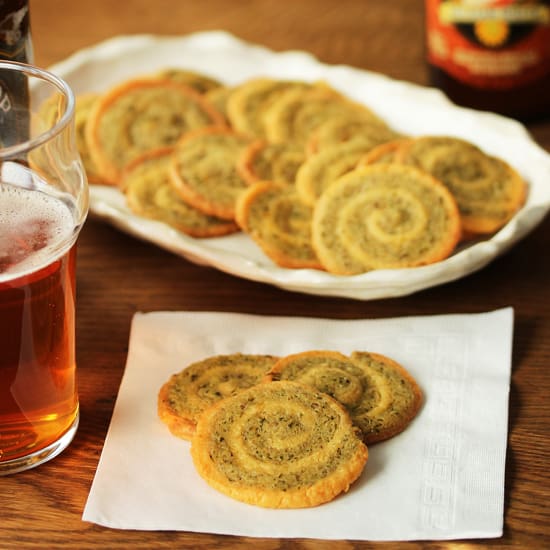 A table with some cookies and beer on it