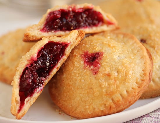 A close up of two pieces of pie on a plate