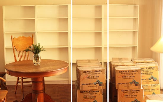 A table and some boxes in front of a wall