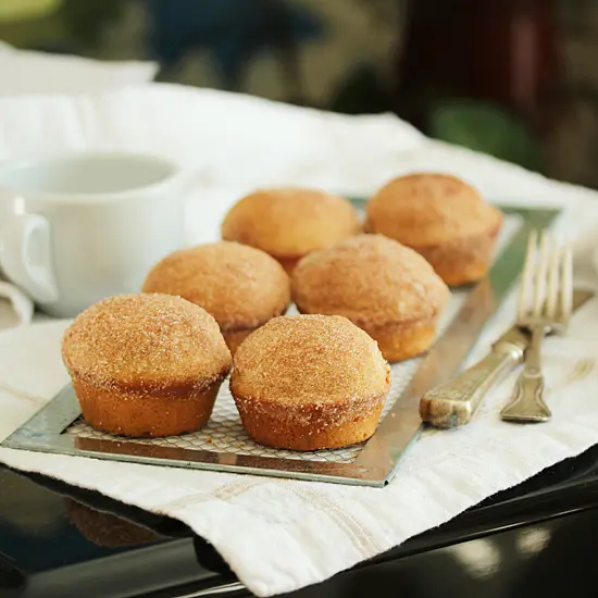 A tray of muffins on top of a table.