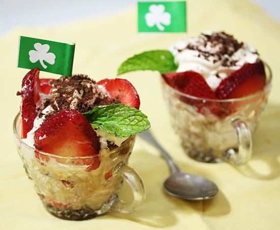 A couple of cups filled with food on top of a table.