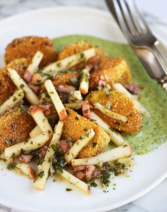 A plate of food with some type of fried food.