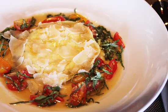 A plate of food with eggs and vegetables on it.