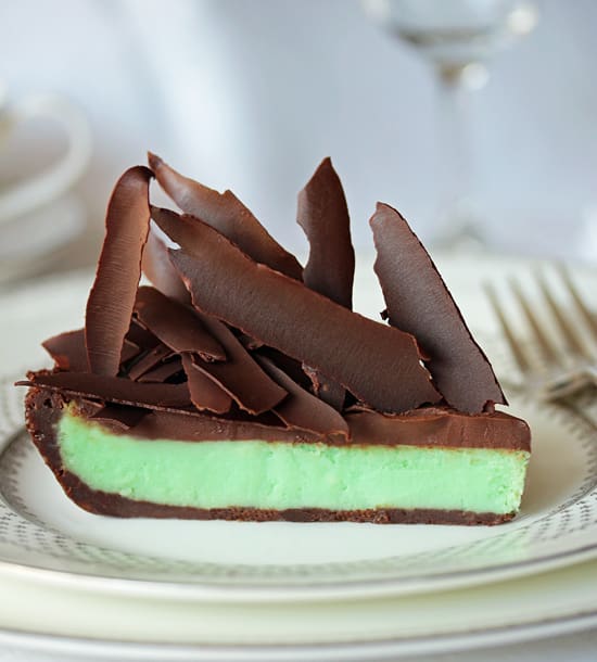 A piece of cake with chocolate on top.