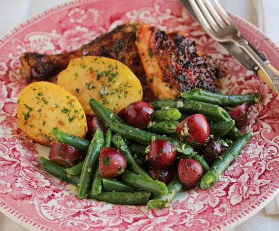 A plate of food with meat and vegetables on it.