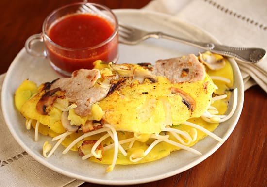 A plate of food with some meat and cheese on it