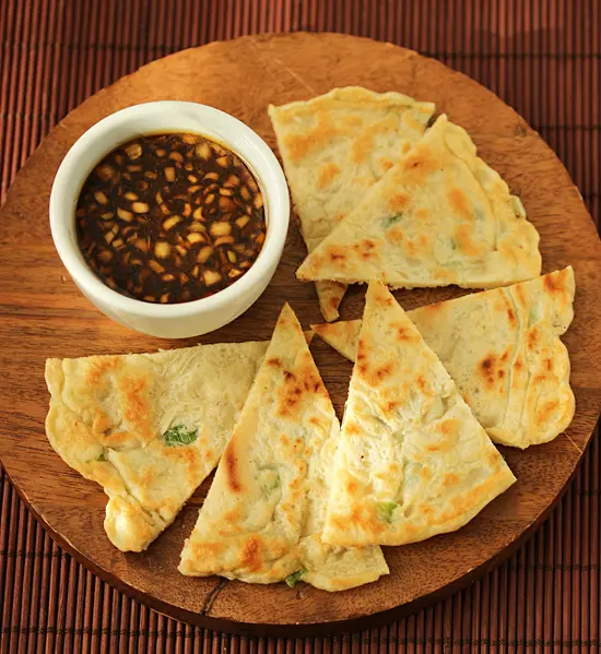 A plate of food with some kind of sauce
