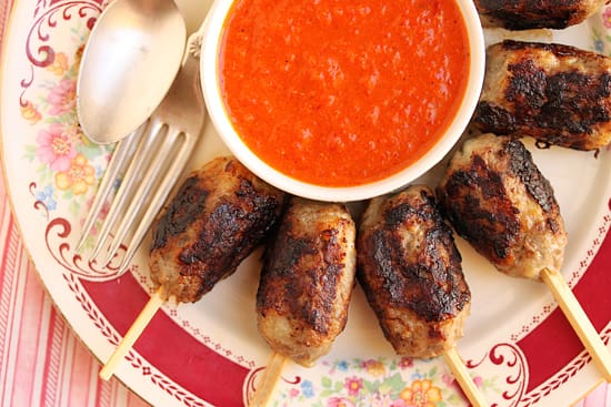 A plate of food with meatballs and sauce.