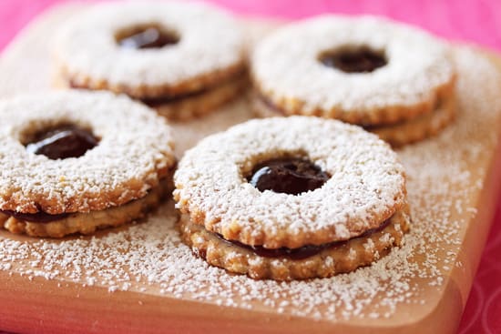 A close up of cookies on a wooden board