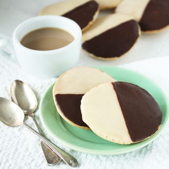 A plate of cookies with chocolate on top.
