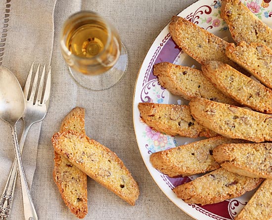 A plate of food and a glass of wine.