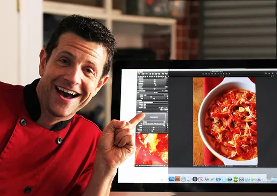 A man pointing to a bowl of food on his computer screen.