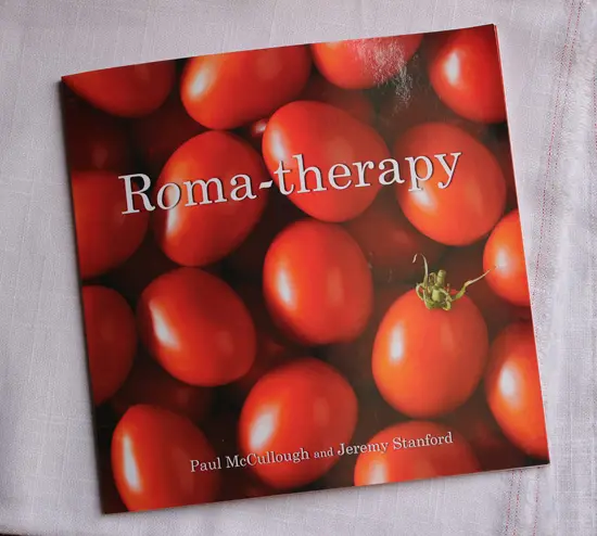 A book cover with tomatoes on it.