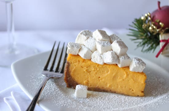 A piece of cake with marshmallows on top.