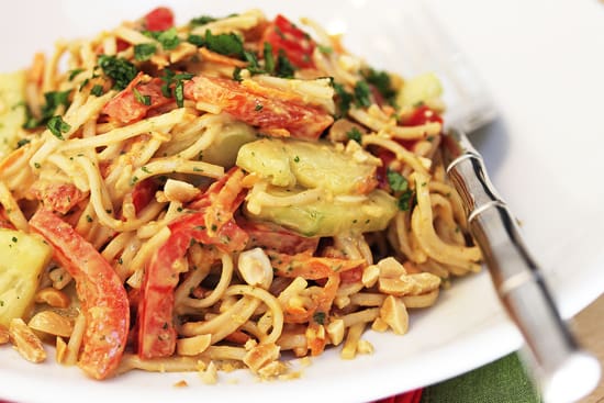 A plate of food with noodles and vegetables.