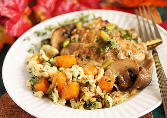 A paper plate with rice and vegetables on it.