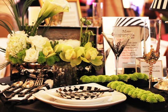 A table set with plates and glasses for a party.