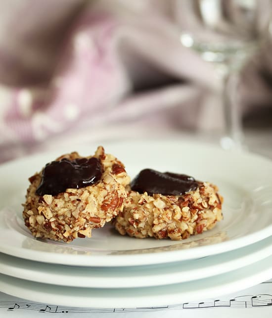 Two pieces of food on a plate with a glass