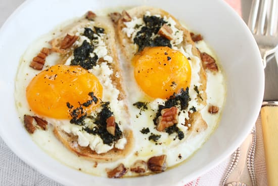 A plate of food with eggs on top.