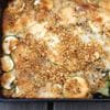 A close up of the casserole dish with zucchini and other vegetables.