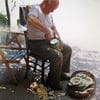 A man sitting in a chair with a basket of food.