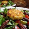 A salad with pecans and other vegetables on top of it.
