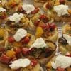 A tray of food with different types of toppings.
