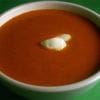 A bowl of soup with butter on top.