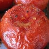 A close up of some tomatoes with a smile on them