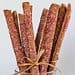 A close up of some sticks in a glass