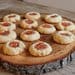 A wooden board with some cookies on it