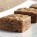 A close up of some brownies on a plate