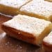 A close up of some lemon bars on a table